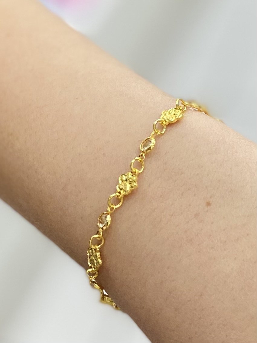 Pulseira patinhas douradas