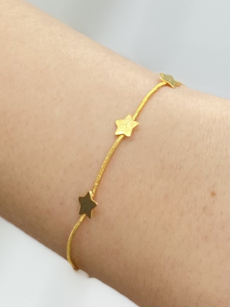 Pulseira de estrela dourada