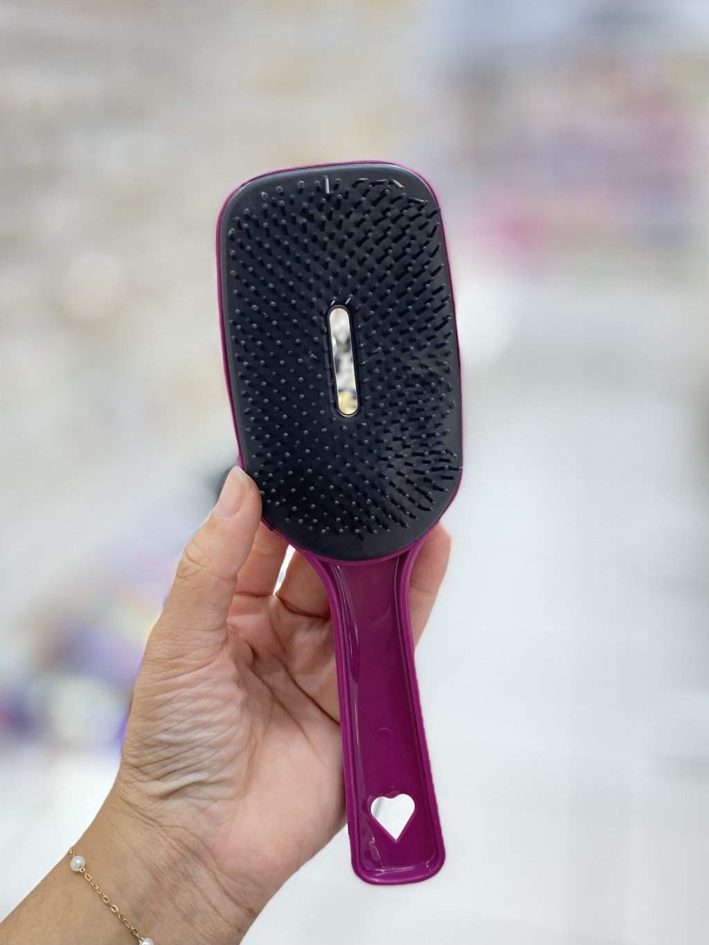 Escova de cabelo com furo 