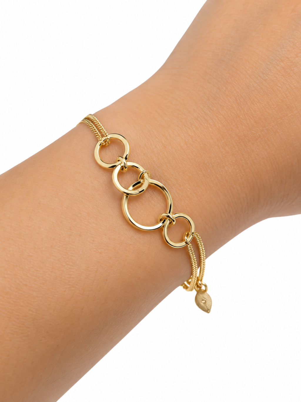 Pulseira semi joia dourada pingente em círculos 