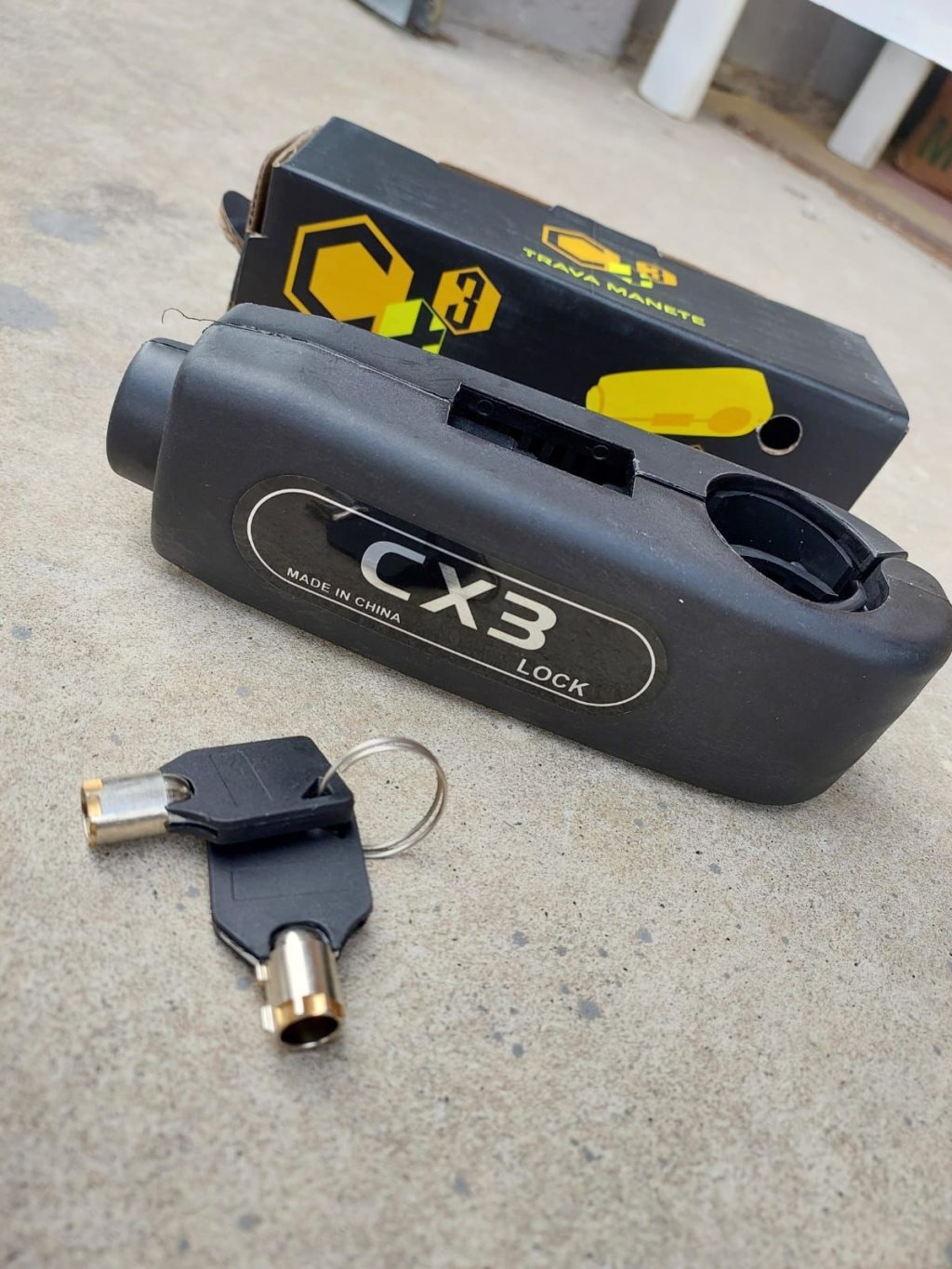 *TRAVA MANETE PLASTICO ABS PRETO