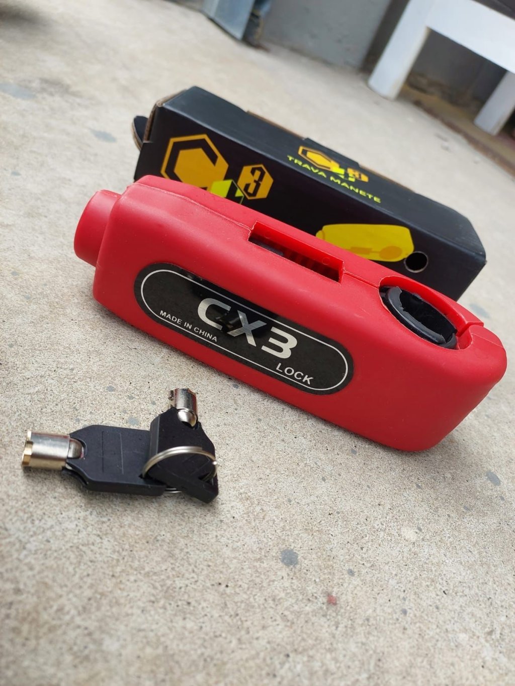 TRAVA MANETE PLASTICO ABS VERMELHO