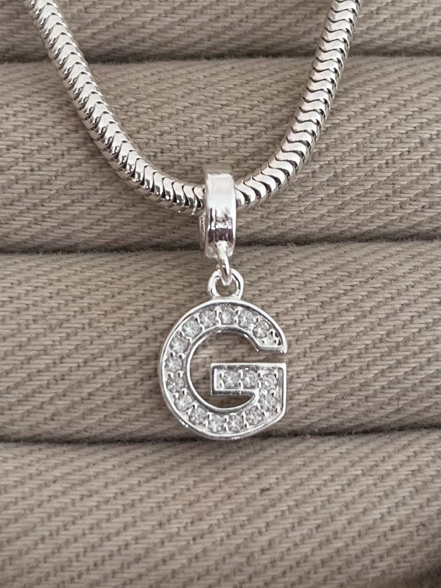 BERLOQUE LETRA G CRAVEJADA 