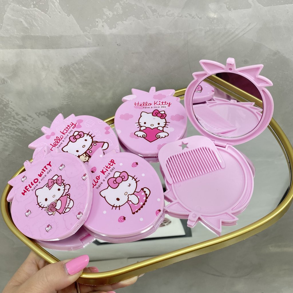 Espelho de bolsa formato morango Hello Kitty c/ pentinho 🩷