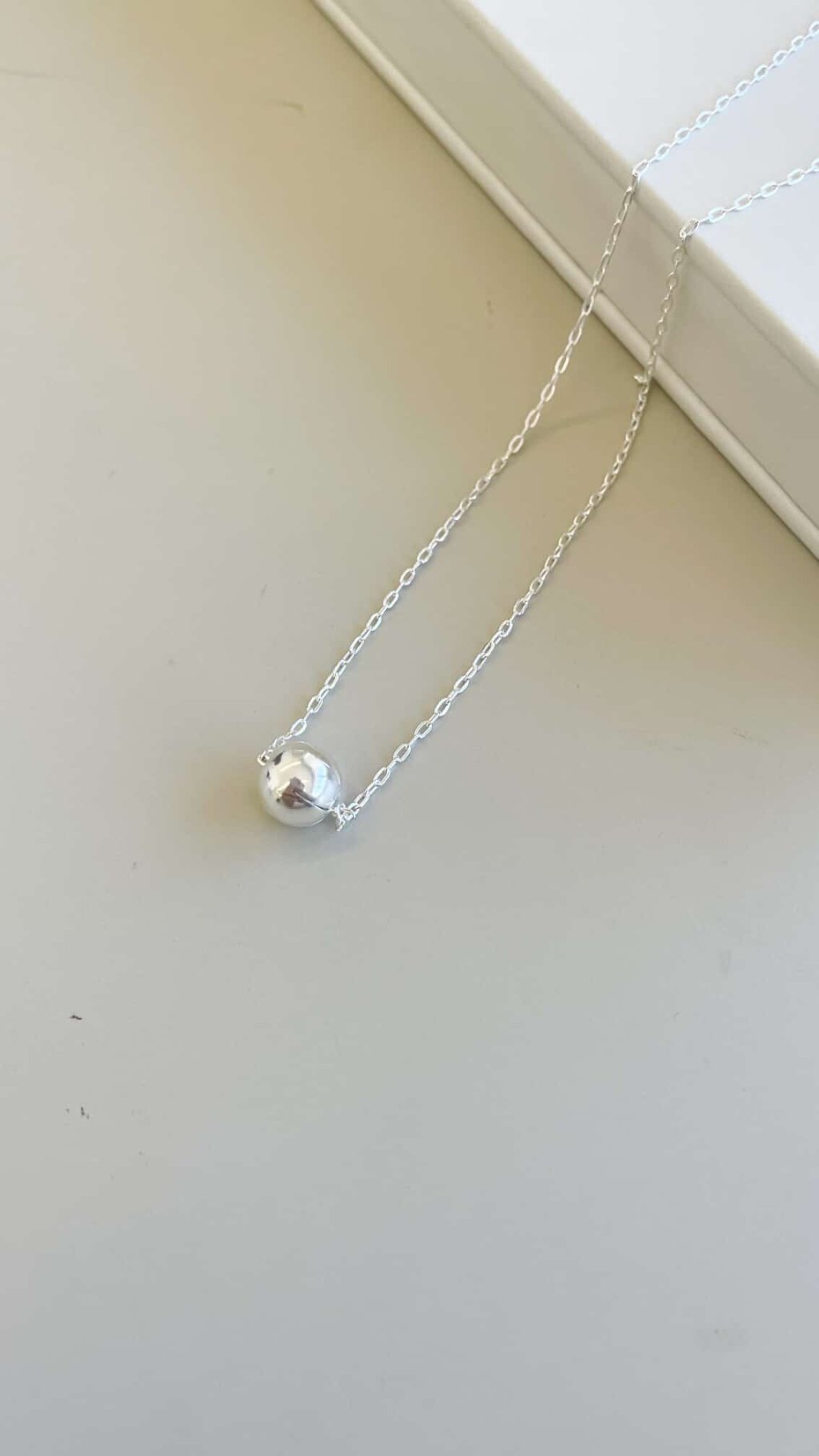 colar com esfera fixa