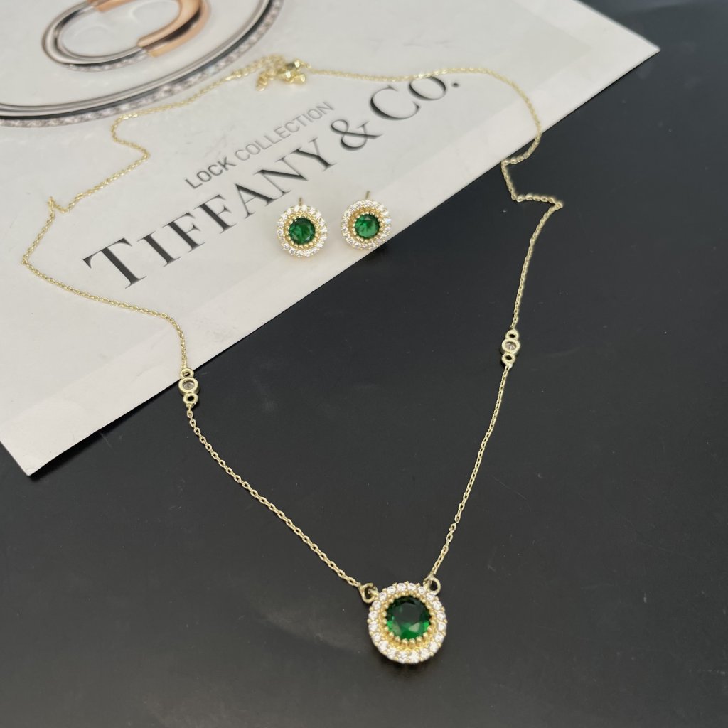 Conjunto esmeralda dourada 