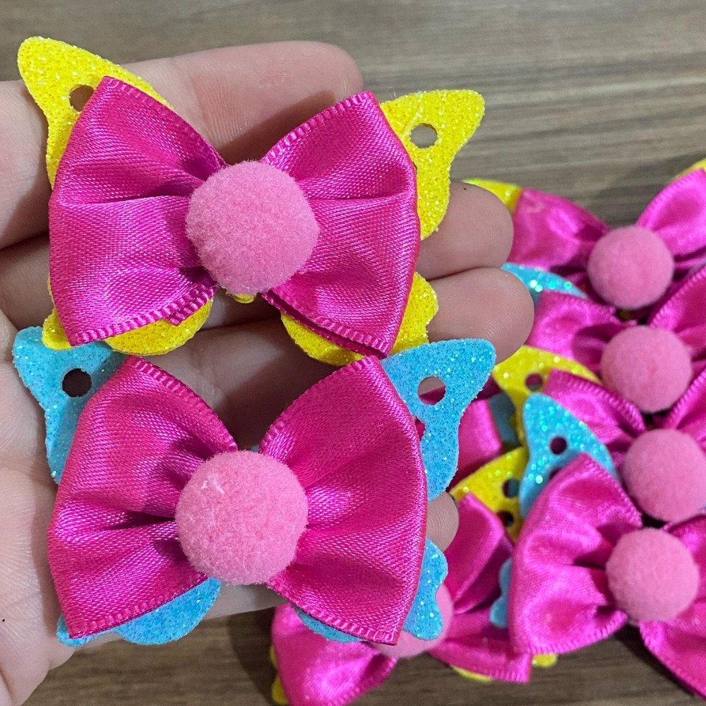 Laço Amarrador rosa com pompom e borboleta