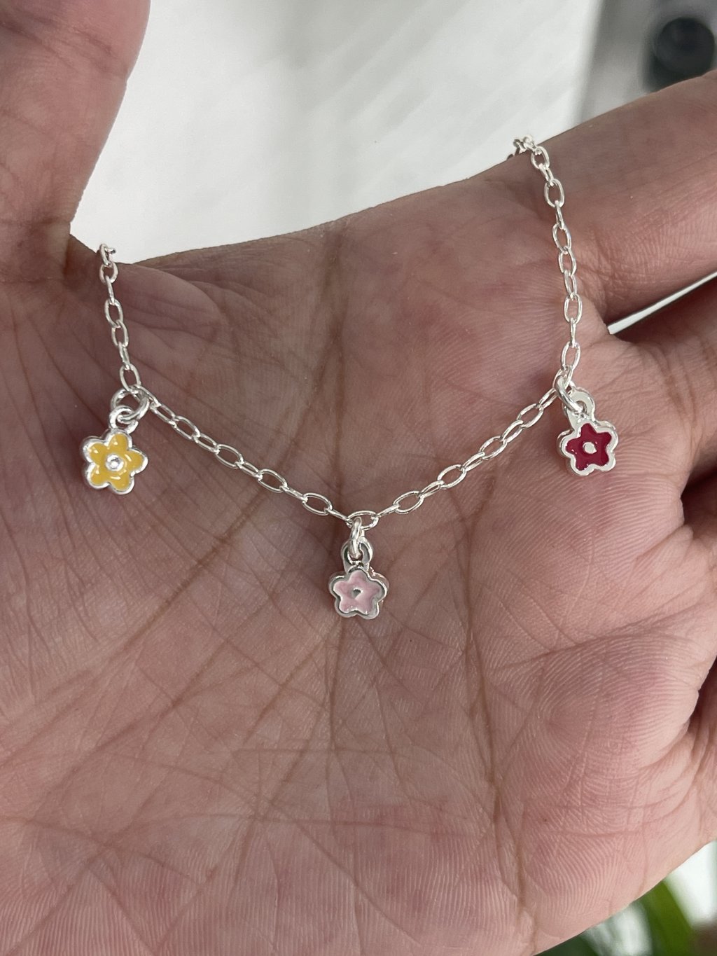 Pulseira infantil ouro/prata 3 flores coloridas